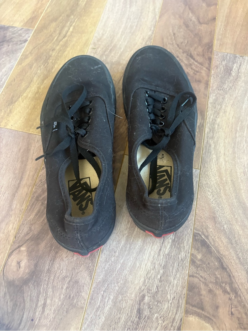 Vans Men’s Black Low-Top Canvas Sneakers with Subtle Red Heel Accent